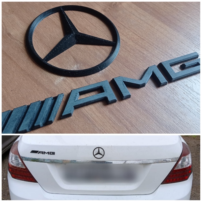 Araçta Mercedes logosu ve AMG tabelası. 3D858268